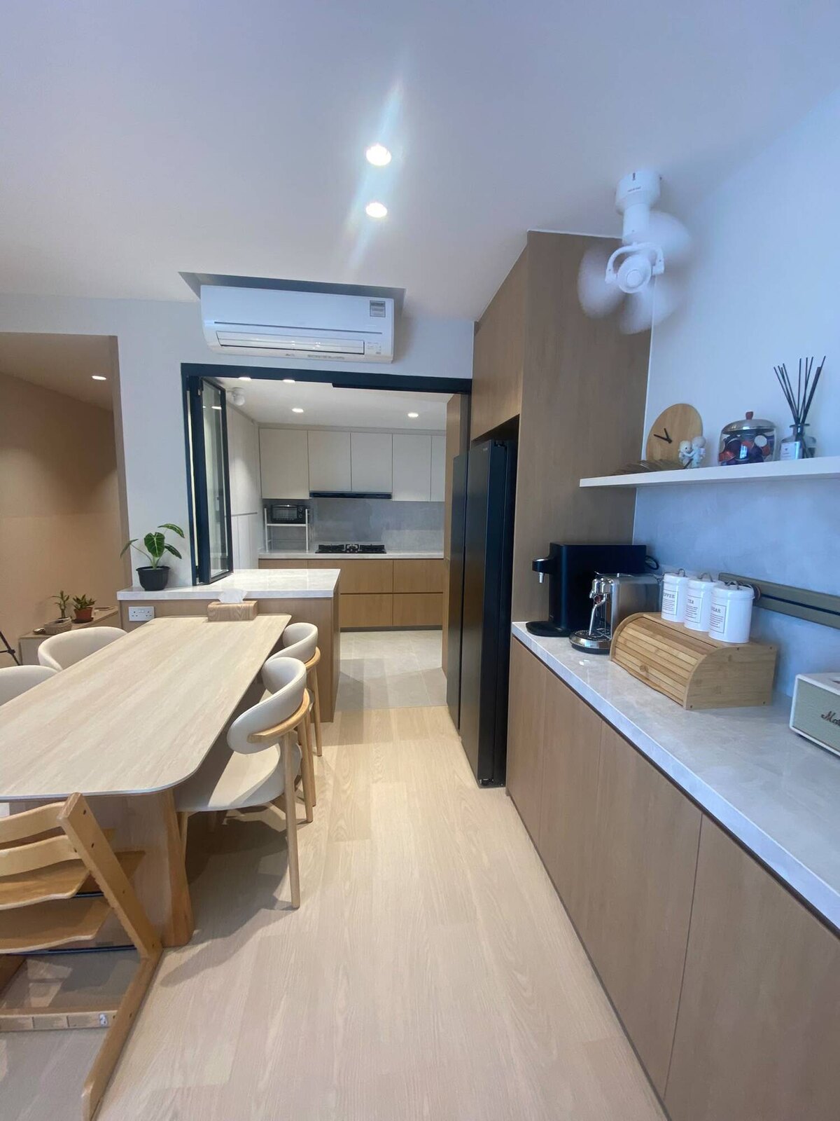 Dining run with a marble-topped oak sideboard