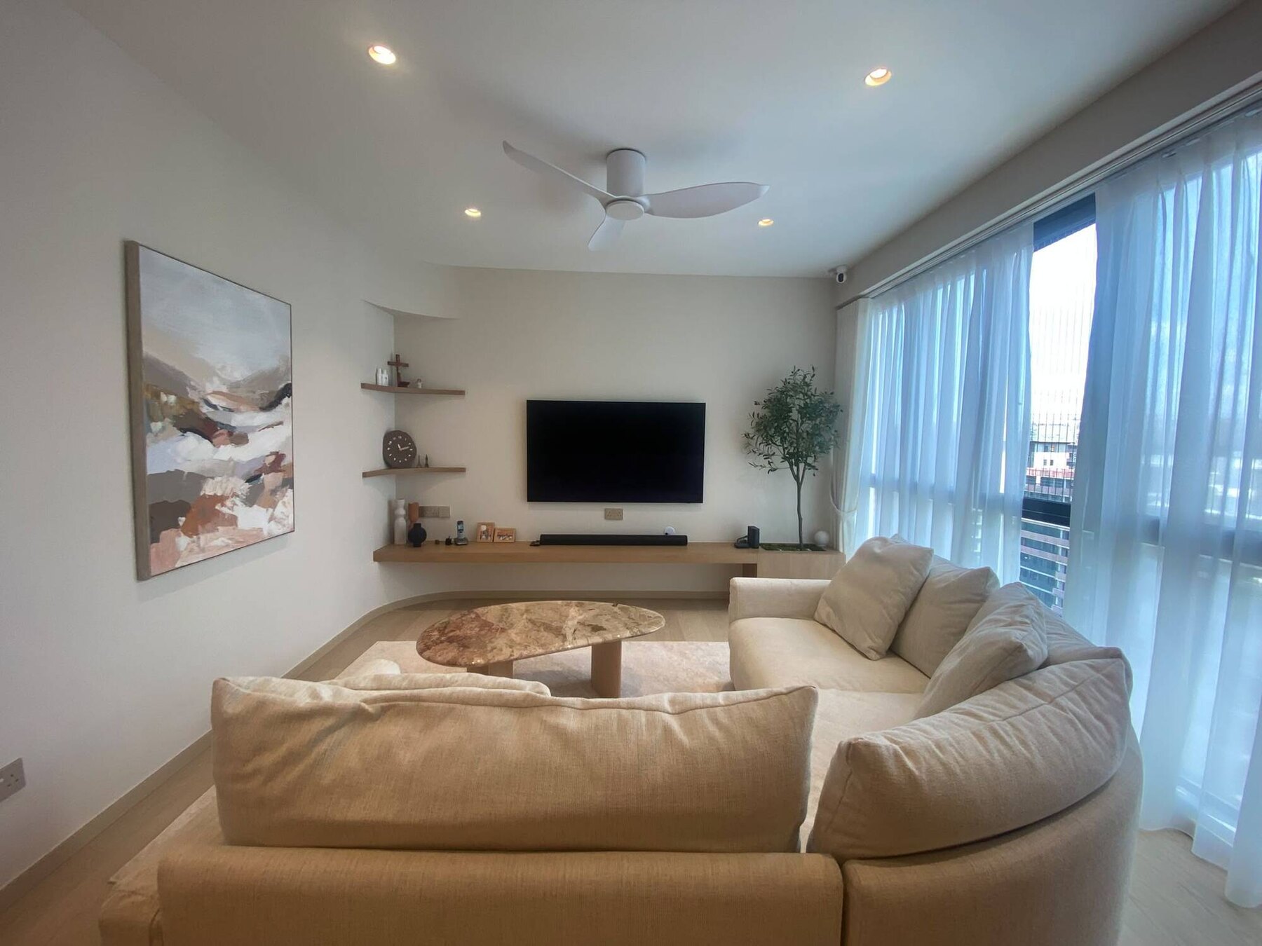 Completed living room with a curved plaster corner niche