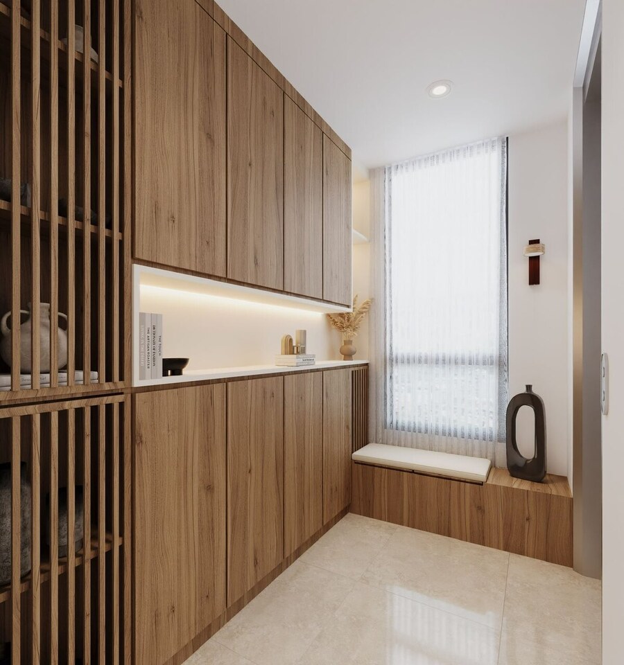 Entryway joinery with a lit stone niche
